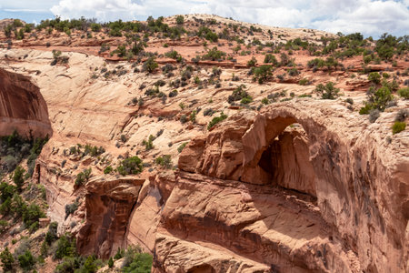 Top view of Mesa Arch near Moab, Canyonlands National Park, San Juan County, Southern Utah, USA. Looking at natural pothole arch rock formation on the eastern edge of Island in the Sky Mesaの写真素材