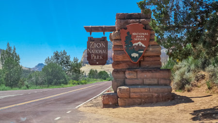 East Entrance to Zion National Park on Mt. Carmel Road in Utah, United States of America, USA. Entrance sign. Mount Carmel U.S. scenic highway 9 to Canyon Overlook. Tranquil atmosphere in wildernessの写真素材