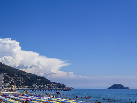 Panoramic view of beautiful coastline of the Ligurian sea on sunny summer day seen from Baba Beach, Alassio, Savona, estern coast of Liguria, Northern Italy, Europe. distant hills, island of Gallinaraの写真素材