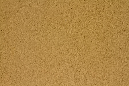 textured background effect concrete wall painted light brownの写真素材