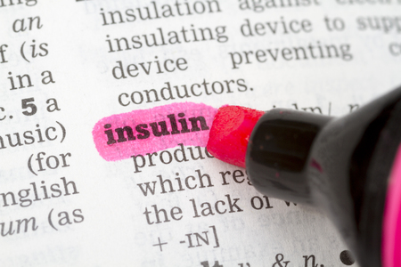 Insulin  Dictionary Definition closeup highlighted in pinkの写真素材