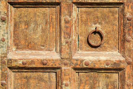 Old wood and iron door in spainの写真素材