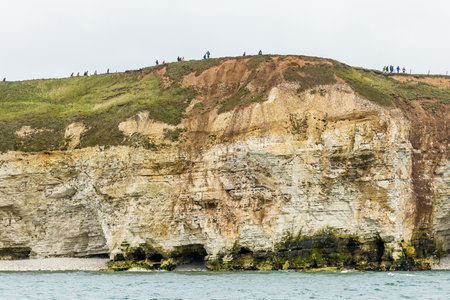 Flamborough with people ontop of the cliffの写真素材