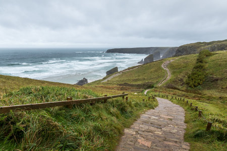 Bedruthan steps in cornwall UK on a cloudy dayの写真素材