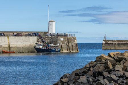 Seahouses, Northumberland UK- June 23 2024: people boarding a boat for a trip to the farne islands.の写真素材
