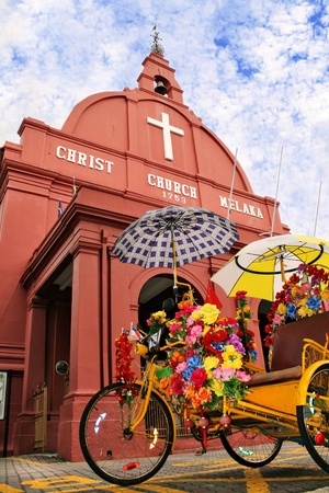 Two icons of Malacca, Malaysia The trishaw  beca  and Christ Church の写真素材