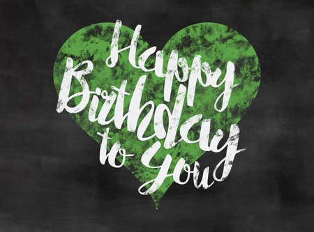words happy birthday to you written on blackboard with green heartの写真素材