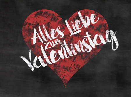 words alles liebe zum valentinstag written on blackboard with red heartの写真素材