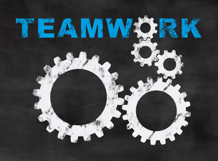 gearwheels on a blackboard, concept for teamwork and collaborationの写真素材