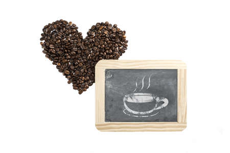 heart made of coffee beans and blackboard with illustration of cupの写真素材