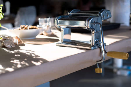 pasta machine mounted on tableの写真素材