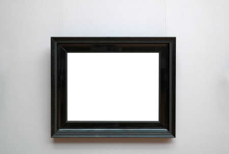 empty ornate picture frame with white copy space hanging on museum wall design templateの写真素材