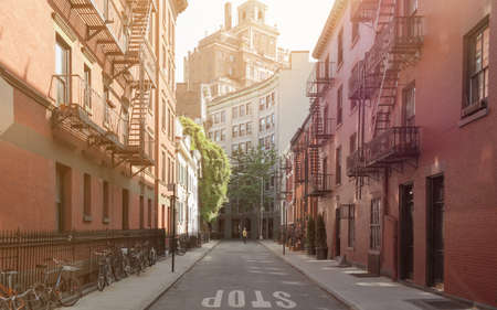 Gay Street in Greenwich Village, Manhattan, New York City with brownstone houses on both sides and the word STOP painted on the street surfaceのeditorial素材