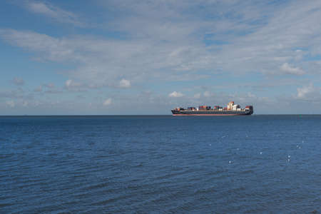 large cargo ship on oceanの写真素材