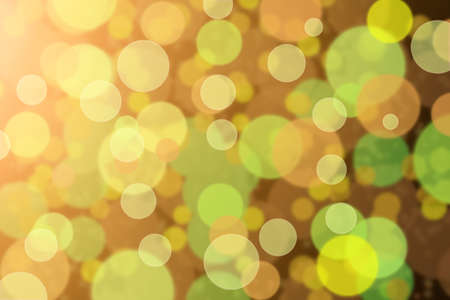 defocused green and orange bokeh backgroundの写真素材