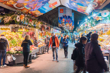Barcelona, Spain 12.14.2017 editorial shot of market stalls and people at Mercat de la Boqueriaのeditorial素材