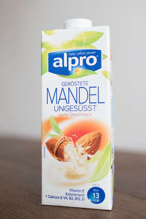 Hamburg, Germany 01.19.2018 illustrative editorial of unsweetened alpro roasted almond milk drink in beverage carton on kitchen tableのeditorial素材