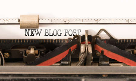 words NEW BLOG POST written on vintage manual typewriter