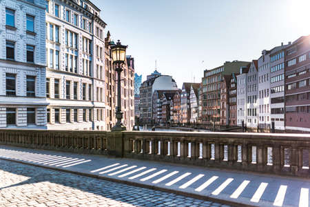 historic buildings on both sides of Nikolaifleet canal in Hamburg, Germany on a sunny dayの写真素材