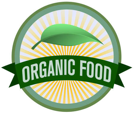 round organic food icon with leaves and golden rays of sunlightの写真素材