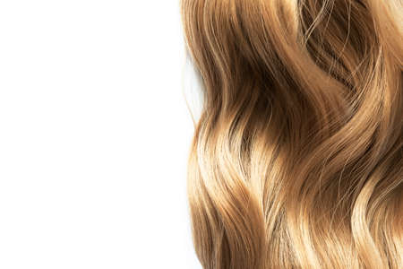 Long blond wavy hair isolated on white backgroundの写真素材