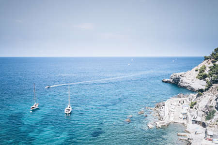 high angle view of boats on turquoise mediterranean seaの写真素材