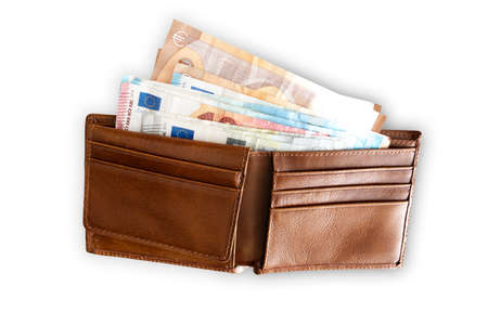 top view of paper money in leather wallet isolated on white background