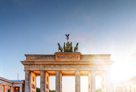 Brandenburg Gate monument as seen from Pariser Platz in Berlin, Germany during sunset on clear summer dayの写真素材