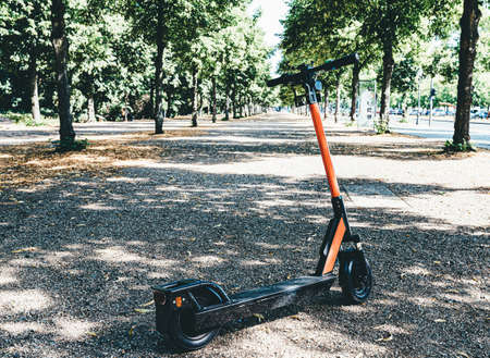 rental e-scooter, motorized scooter, parked in public park in Berlin, Germanyの写真素材