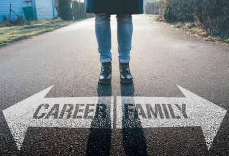 female person having to decide between career and familyの写真素材