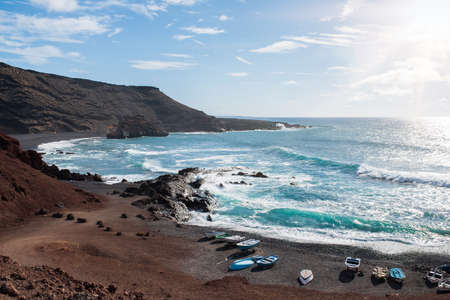 beautiful coastal landscape near El Golfo, Lanzarote against troubled blue ocean and clear skyの写真素材