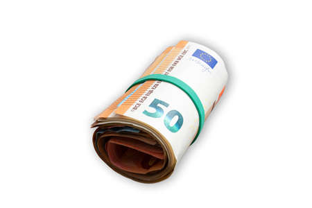 close-up of money roll with rubber band isolated on white backgroundの写真素材