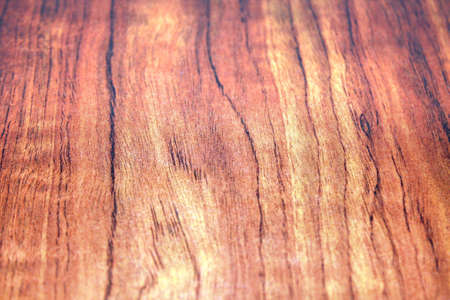 red wood finish on a slab, showing subdued colours and finer wood graining details