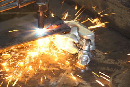 Oxyacetylene Torch throwing sparks while cutting steel