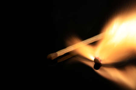 Match exploding isolated on black
