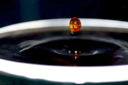 Droplet of coffee in a mugの写真素材