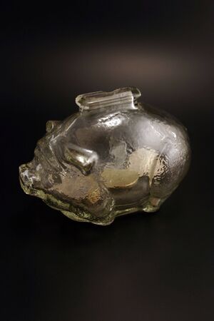 Glass piggy bank on black backgroundの写真素材