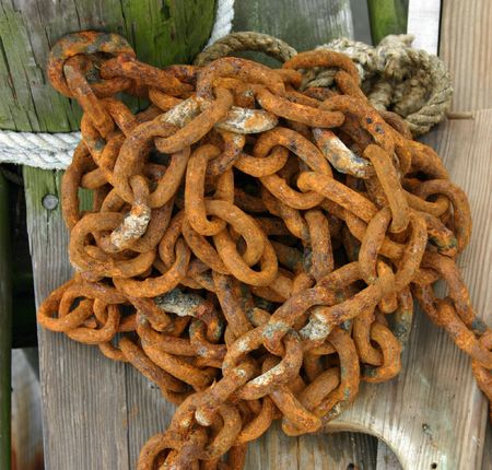 An old rusty chain on a dock in a harbor in Cape Cod, Massachusettsの写真素材