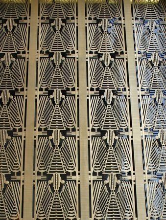 The Art Deco pattern above the entrance to a skyscraper in NYC