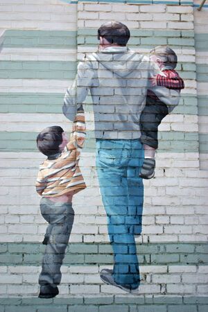 A mural painted on the side of a brick buildingのeditorial素材