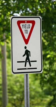 A yield sign waring of a pedestrian crossingの写真素材