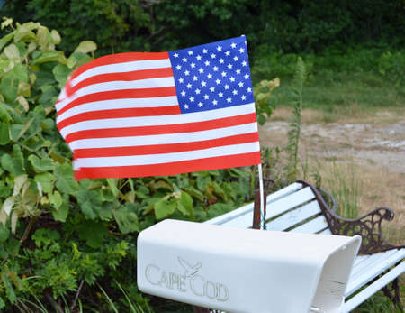 A white mailbox with a waving American flagの写真素材