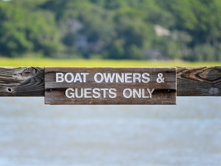 A sign reading Boat Owners & Guests Onlyの写真素材