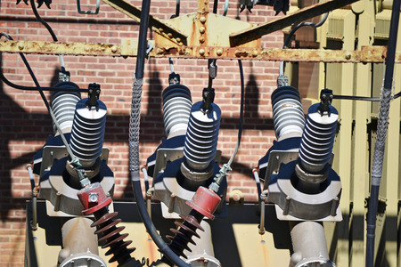 A view of a high voltage substation with switches and insulators