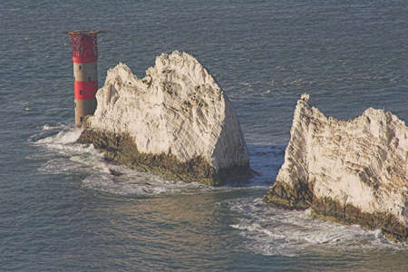 The needles lighthouse and rocks, with sea and waves.の写真素材