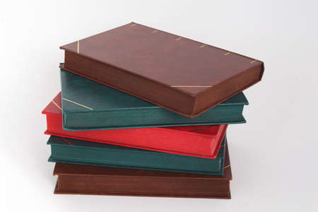 pile of colored leather bound old books