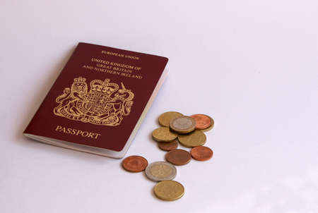 British passport with euro cash on white backgroundの写真素材
