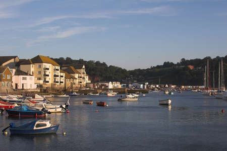 estuary harbour with boats & housesの写真素材