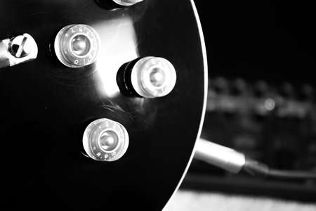 black Electric guitar body with silver pickups , chrome bridge and gold control knobsの写真素材