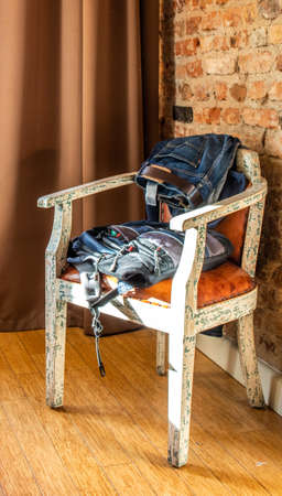 Clothes on a chair in a hotel roomの写真素材